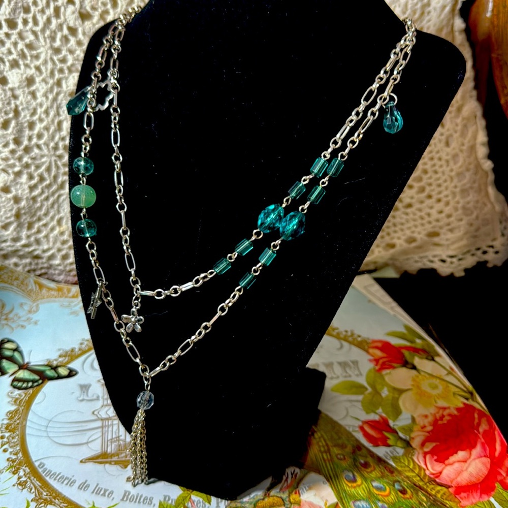 62” silver tone fetish necklace. Turquoise and green glass beads, birds, hearts